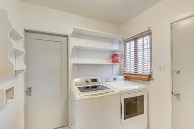 a kitchen with a washer and dryer in a room at 1 Mi to Melrose Ave and Grove! Upscale LA Retreat in Los Angeles