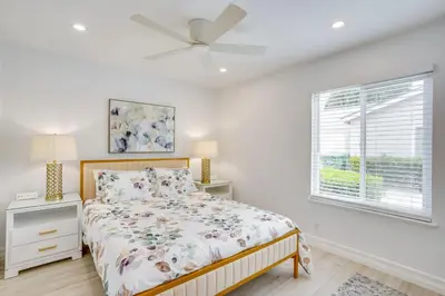 a bedroom with a bed and a ceiling fan at Idyllic Tustin Home with Private Patio and Grill in Tustin