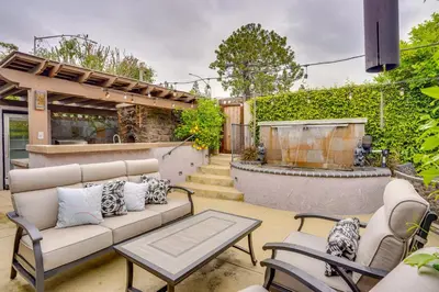 a patio with a couch and chairs and a table at Lovely Tustin Home with Outdoor Kitchen 3 Mi to Zoo in Tustin