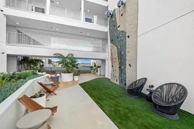 an apartment with a climbing wall and a rock wall at Luxury & Modern Apt by the Grove in Los Angeles