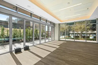 an empty office building with large windows at Brand New Modern & Luxury Residence in DTLA in Los Angeles