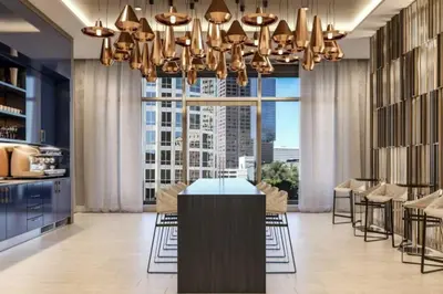 a dining room with a chandelier and a table at Epitome of Luxury Condo in DTLA in Los Angeles