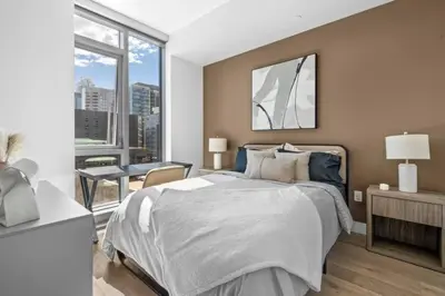 a bedroom with a large bed and a large window at Epitome of Luxury Condo in DTLA in Los Angeles