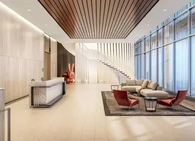 a lobby with a couch and chairs and a table at Epitome of Luxury Condo in DTLA in Los Angeles