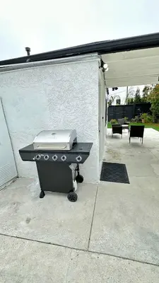a barbecue grill sitting on a concrete patio at Modern 2BR Stylish & Cozy Unit in Los Angeles