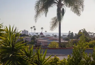 a view of a city with palm trees and buildings at Elegant Ocean View Studio in Prime Santa Monica Location in Los Angeles