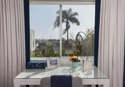 a large window with a table in a room with a view at Elegant Ocean View Studio in Prime Santa Monica Location in Los Angeles