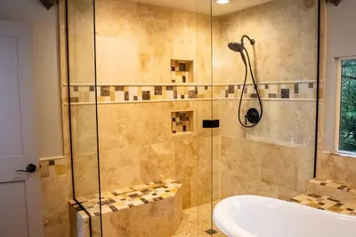 a bathroom with a shower and a tub and a sink at The Mighty Pines Retreat + Large Patio + BBQ+View! in Lake Arrowhead