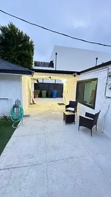 a patio with two benches and a garage at Modern Studio Stylish &Cozy Back Unit in Los Angeles