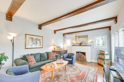 a living room with a couch and a fireplace at 2 Blocks to Melrose Ave! Home with Furnished Patio in Los Angeles