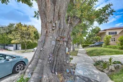 a tree with lots of decorations on it at 2 Blocks to Melrose Ave! Home with Furnished Patio in Los Angeles