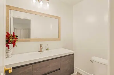 a bathroom with a sink and a mirror at @ Marbella Lane - Hidden Gem in Orange County in Orange