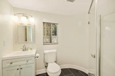 a bathroom with a toilet and a sink and a shower at @ Marbella Lane - Hidden Gem in Orange County in Orange