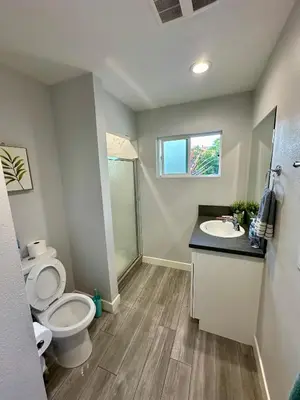 a bathroom with a toilet and a sink at Cheers Hostel in Los Angeles