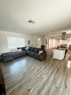 a living room with a couch and a table at Cheers Hostel in Los Angeles