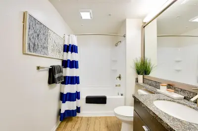 a bathroom with a shower and a toilet and a sink at Cozy Unit Conveniently Located Pool View in Los Angeles