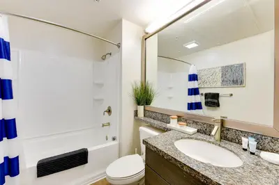 a bathroom with a sink and a toilet at Cozy Unit Conveniently Located Pool View in Los Angeles