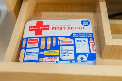 a package of first aid kit in a wooden drawer at Urban Oasis Luxe Glamping with King Bed & BBQ in Glendora