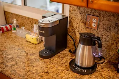 a kitchen counter with a coffee maker on a counter top at Peaceful Family Home with 3 Bedrooms and 2 Bathrooms in Glendora