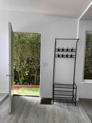 a room with a mirror and a door with a window at 30 PCT OFF!! Limited Time! Malibu Ocean Wave with King Bed, Walking to Beach and Hiking in Malibu