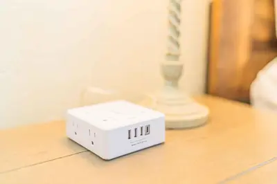 a white box sitting on a table next to a vase at Newly Remodeled 3B2B House in Glendora