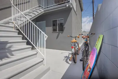 two bikes parked on the side of a building at Beautiful renovated studio close to ocean! in Los Angeles