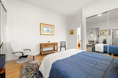 a bedroom with a bed and a desk and a chair at Hollywood Hills Retreat w Sweeping Views 2 Bd 2 Bt in Los Angeles