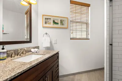 a bathroom with a sink and a mirror at Hollywood Hills Retreat w Sweeping Views 2 Bd 2 Bt in Los Angeles