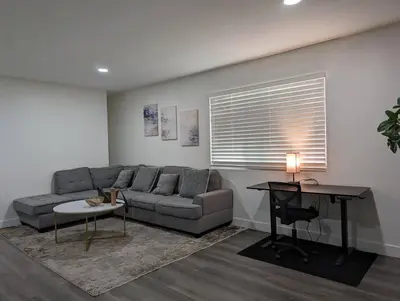 a living room with a couch and a table at City Retreat Minutes to DT in Alhambra