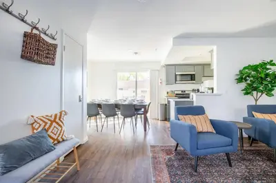 a living room with a couch and chairs and a table at 4 bedroom Alhambra Condo near downtown LA in Alhambra