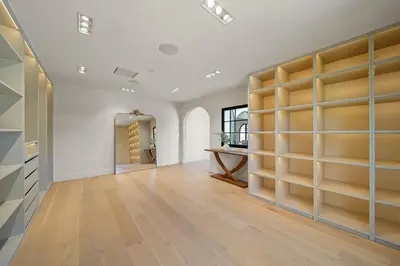 a large room with wooden shelves in a wall at Bella Villa in Los Angeles