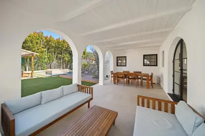 a living room with a couch and a table at Bella Villa in Los Angeles