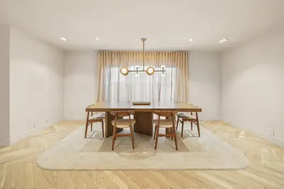 a dining room with a table and chairs at Bella Villa in Los Angeles