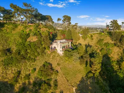 an aerial view of a house on a hill at Summitridge in Los Angeles