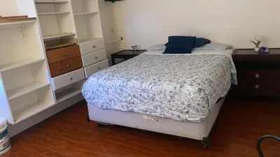 a bedroom with a bed and a dresser at Westminster Zen Home in Westminster