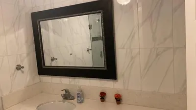a bathroom with a sink and a mirror at Westminster Zen Home in Westminster