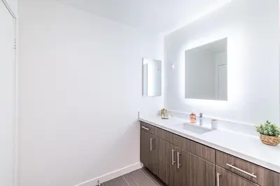 a bathroom with a sink and a mirror at Hollywood Furnished Apartments in Los Angeles