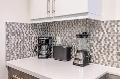a kitchen counter with a blender on a counter top at Hollywood Furnished Apartments in Los Angeles