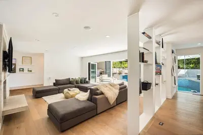 a living room with a couch and a pool at Beverly Hills Canyon Villa by Stay Awhile Villas in Los Angeles