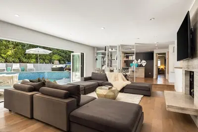 a living room with a couch and a fireplace at Beverly Hills Canyon Villa by Stay Awhile Villas in Los Angeles