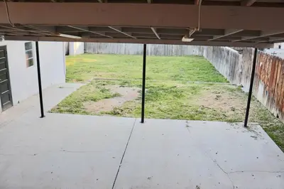an empty room with a field of grass in a building at Modern La Cresta in Bakersfield