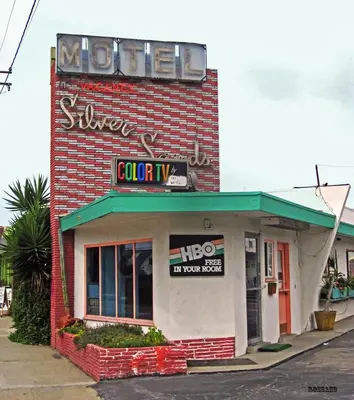 a sign on the side of a sushi restaurant at Silver Sands Motel in Ventura