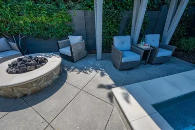 a patio with two chairs and a fire pit at Amazing days Spa Pool Villa near Disney & Beaches in Placentia