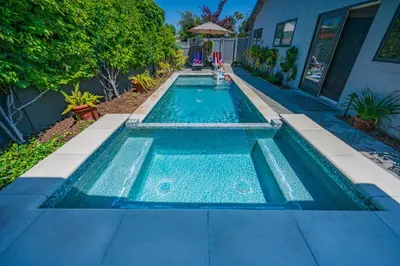 a swimming pool in front of a house at Amazing days Spa Pool Villa near Disney & Beaches in Placentia