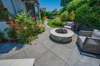 a patio with two chairs and a fire pit at Amazing days Spa Pool Villa near Disney & Beaches in Placentia