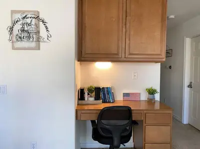a desk with a black chair in a room at Bella's sweet house 5640 in Eastvale