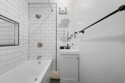 a white bathroom with a tub and a sink at # Marbella Lane - Serene & Spacious 3BR Haven in West Covina