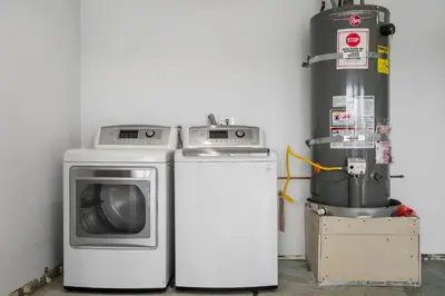 a washer and dryer next to a water tank at # Marbella Lane - Serene & Spacious 3BR Haven in West Covina