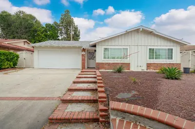 a house with a brick driveway in front of it at # Marbella Lane - Serene & Spacious 3BR Haven in West Covina