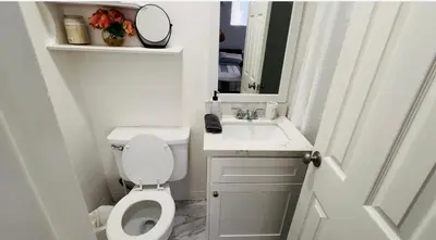 a small bathroom with a toilet and a sink at Sunset & La brea studio!! Best location ever in Los Angeles